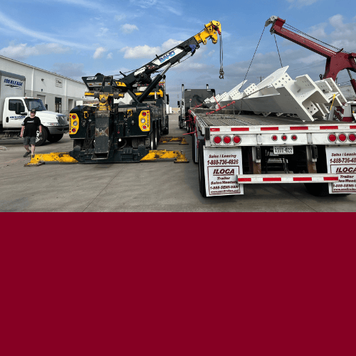 two heavy duty towing tow trucks providing crane services in the city of San Antonio Texas